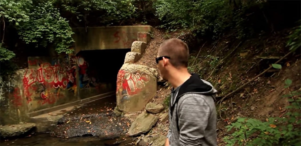 Satan's Hollow in Blue Ash
Blue Ash is known for many remarkable things, like a large 150-foot observation tower at Summit Park, the second location of Over-the-Rhine’s Senate, and a purported tunnel to the netherworld. The story goes that local Satanic groups would meet at a drainage tunnel in Blue Ash to conduct rituals. In doing so, they opened a portal to hell itself. Whoops! The graffiti-tagged abyss has pentagrams and phrases like “Hell lies ahead” sprayed on the walls. Many have reported screams, trapped spirits and apparitions including a demon referred to as “The Shadow Man.” Wanna check it out for yourself? Alas, Satan’s Hollow is on private property. Instead, you might have to settle for checking out Satan’s Hollow: The Tunnel to Hell, a short, 10-minute paranormal investigation “documentary” about the spot released in 2012. It’s on YouTube.