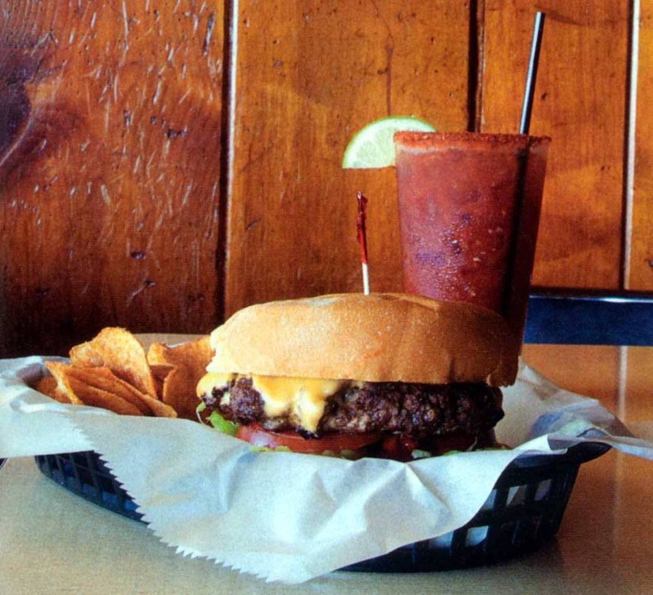 City View Tavern: Big Ted Deluxe
403 Oregon St., Mt. Adams
Who it’s named after: Ted Lagemann, the former owner of City View Tavern who legend says banned tequila from the bar after stopping Charles Manson (yep, that Charles Manson) from leaping off the establishment’s deck one night in a tequila-fueled craze.
The burger: Topped with American cheese, brown mustard, ketchup, mayo, onion, lettuce, tomato and pickle.