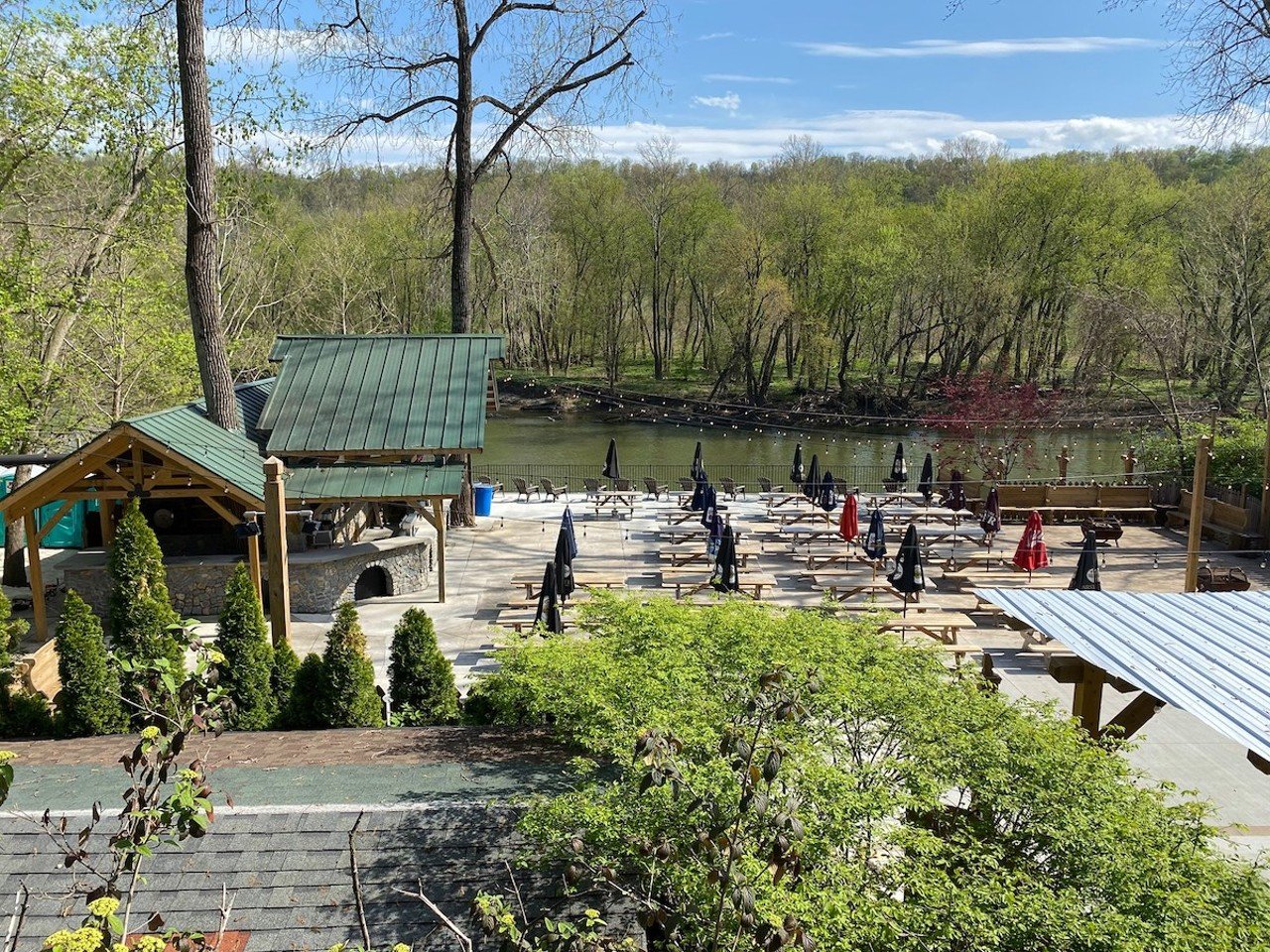 Kreimer’s on the River
6052 OH-128, Whitewater Township
Located in the backyard of Kreimer’s Bier Haus, this Bavarian biergarten on the Great Miami River has three decks, fire pits and a ton of Black Forest-inspired wood features, from picnic seating to a whimsical cuckoo-clock-looking German grill house, which serves snacks like sauerkraut balls, pretzel bread, bier cheese and plenty of juicy metts. You can also order to-go from the restaurant and take your meal into the biergarten for dinner with a view.