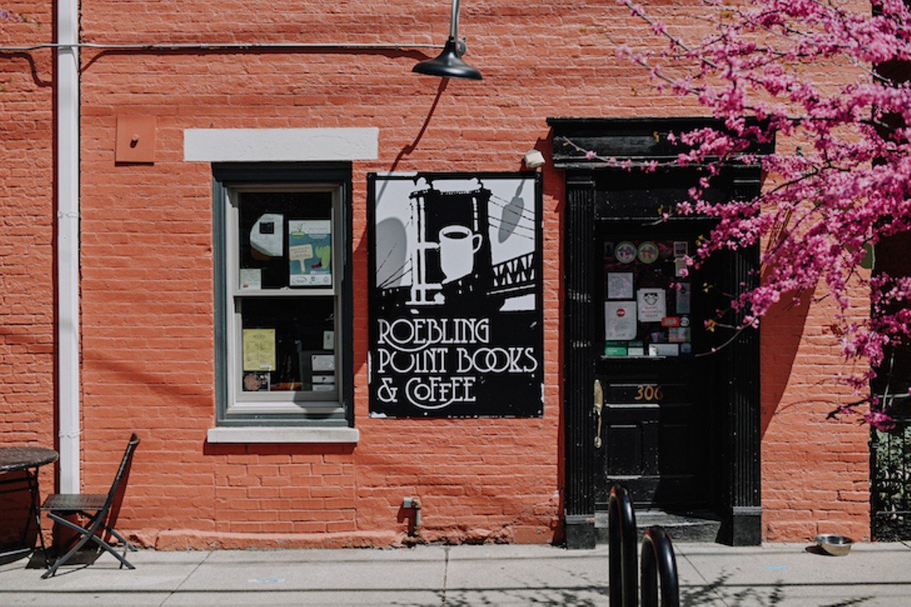 Roebling Point Books & Coffee
306 Greenup St., Covington
As the name suggests, Roebling Point is both an indie bookstore and community coffee shop. Owner Richard Hunt likes to refer to it as a "third place"  that space that isn't work or home but feels just as comfortable. Roebling Point has created its niche by providing fair-trade, organic coffee in addition to books and by sharing profound quotes on the chalkboards on the building's exterior. Multiple rooms house a customer-influenced book inventory. Fiction and non-fiction works rest among local authors, poetry, children's books and a handful of classics.