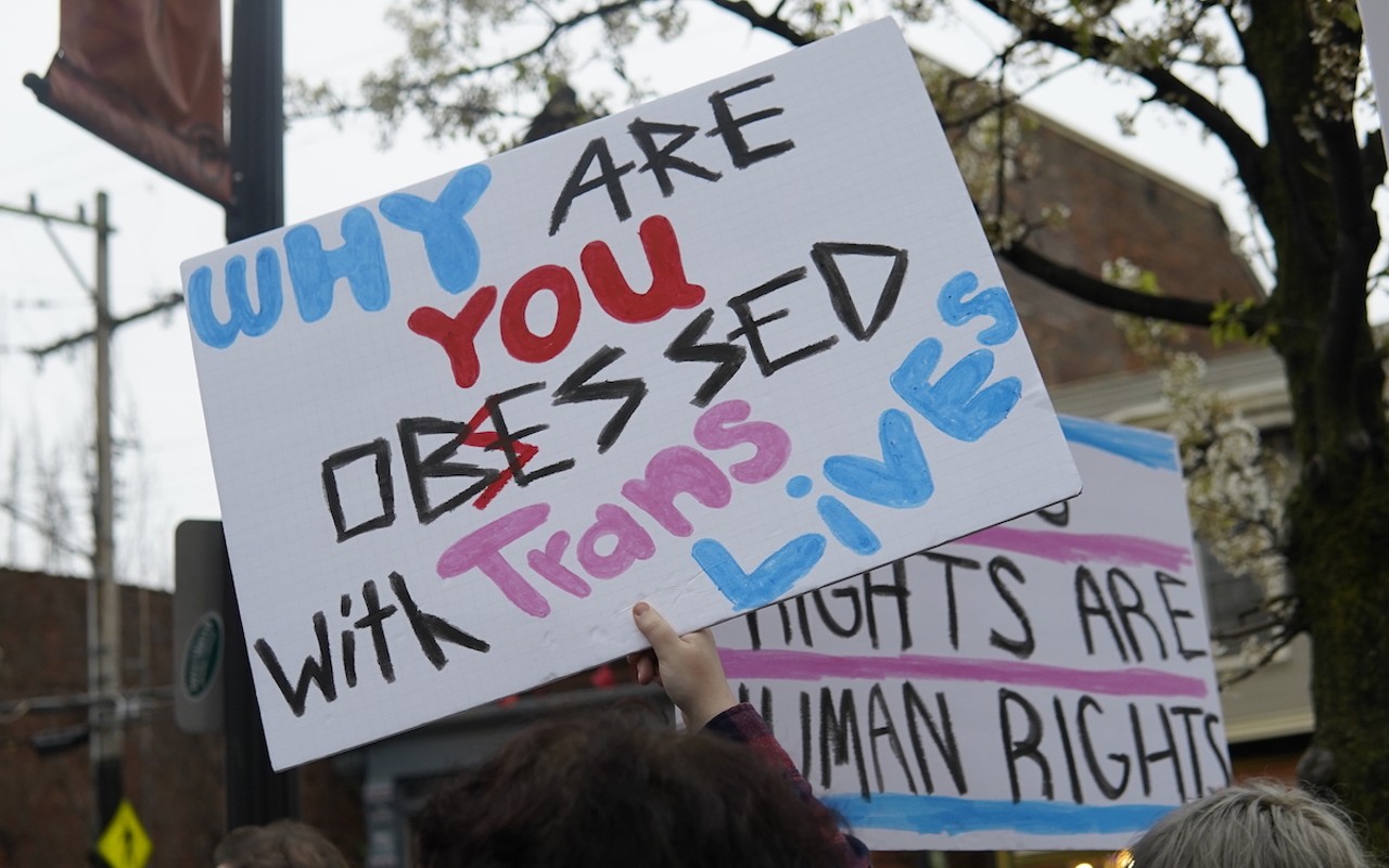 Participants hold signs at Northside's National March for Queer and Trans Youth Autonomy on March 31, 2023.