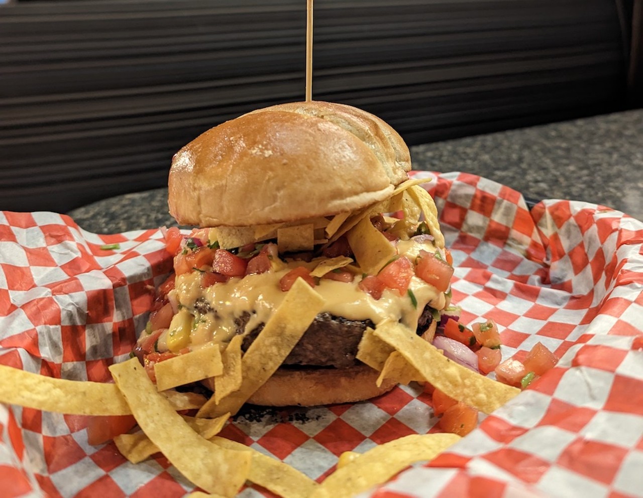 Slatts Pub
4858 Cooper Road, Blue Ash
That's Nacho Cheeseburger: Half-pound burger on a gourmet bun and topped with homemade nacho cheese, tortilla strips and pico de gallo.