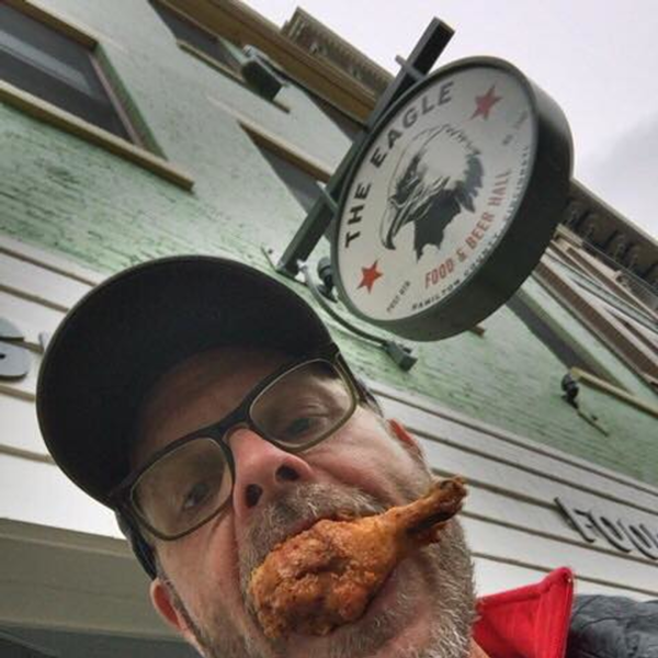 Alton Brown enjoying The Eagle OTR's chicken