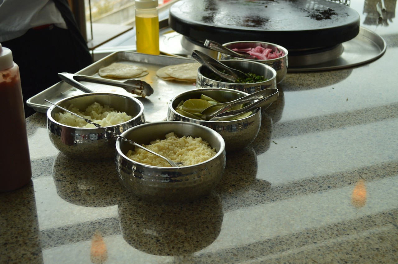 A chef prepares tacos at Great American Ball Park's The Handlebar.