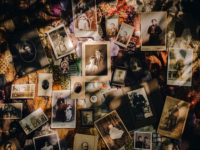 Photos and tintypes of people possibly buried in West Price Hill's Potter's Field lay scattered across a quilt on the cemetery's historic carriage path. Trees and Honeysuckle overgrowth, some containing the organic matter of those buried below, shade the mysterious faces not yet identified by Potter's advocate, Sandy Rice.