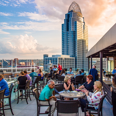 Top of the Park506 E. Fourth St., DowntownFor a stunning, nearly-360-degree view of downtown Cincinnati and its riverfront, plus some amazing craft cocktails, snag the elevator in the lobby of The Phelps hotel and take it to the very top where you’ll find one of the best rooftop bars in the city. Top of the Park is intimate, with plenty of comfy seating, including a glass bar top where you can sit with your drink and enjoy the bird’s-eye view. Grab a Rooftop Lemonade (Ketel One Citroen, muddled strawberries, fresh lemon juice and wild berry simple syrup) and toast to an amazing summer.