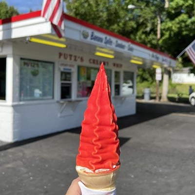 Putz’s Creamy Whip2673 Putz Place, WestwoodSummertime means it’s also time to hit the local creamy whip, and one of those creamy whips has been serving up smiles in a cone every summer for nearly 90 years. Putz’s Creamy Whip has been in the family since the day Constantine and Anna Putz opened their first trolley car walk-up ice cream window in 1938. The Putz’s as we know it — now in a square concrete structure just down the hill from Mt. Airy Forest — is a scoop of summer nostalgia. Not much about this place has changed over the past several decades. Of the current generation, Putz descendant Mindy Borgman has been cranking out cones at the creamy whip for the last few decades — all on the same Electro-Freeze machine. Another tradition? Putz’s is cash-only. Despite the hoopla about the vintage ice cream machine and vanilla soft serve, the pineapple sherbet is a must. It is creamy like soft serve and tangy to boot. “Face cones” are also a hot commodity at Putz’s. The soft serve cones are adorned with Necco wafer ears and crunchy googly-eyed candy.