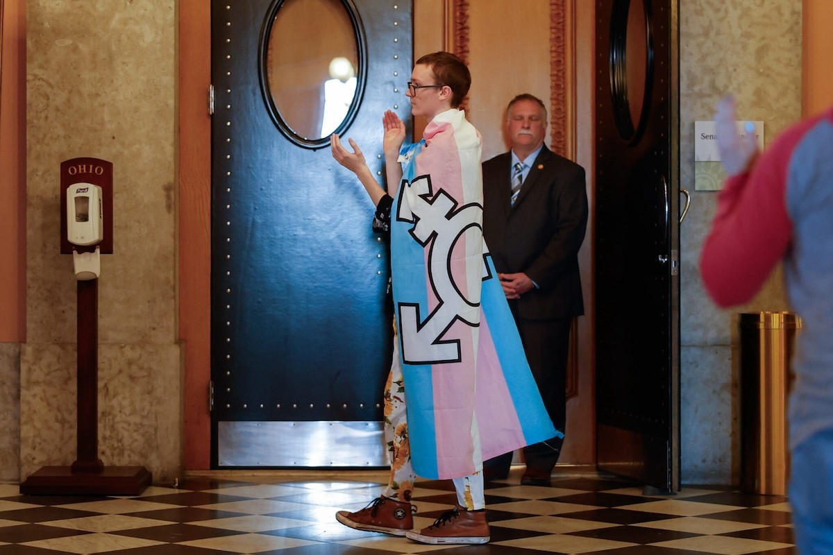 COLUMBUS, Ohio — DECEMBER 13: Advocates for the trans community protest outside the Senate Chamber while inside lawmakers debated and passed HB 68 that bans gender-affirming care for transgender youth and bars transgender kids from participating on sports teams, December 13, 2023, at the Statehouse in Columbus, Ohio.