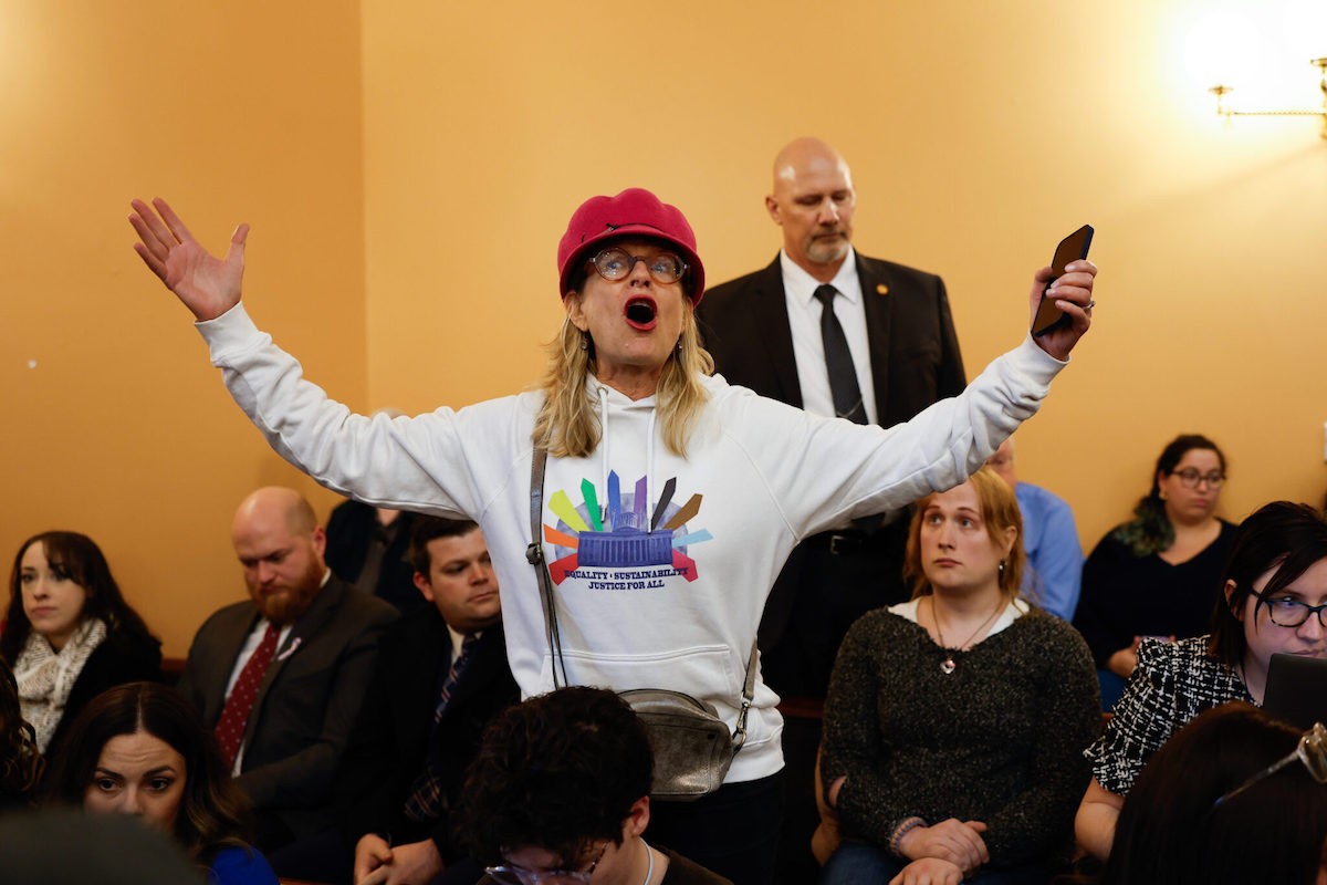 COLUMBUS, OH — JANUARY 24: A protester asks senators to not override Gov. Mike DeWine’s veto of House Bill 68 that would limit medical care for transgender minors and block transgender girls from sports during the Ohio Senate session, January 24, 2024, at the Statehouse in Columbus, Ohio.