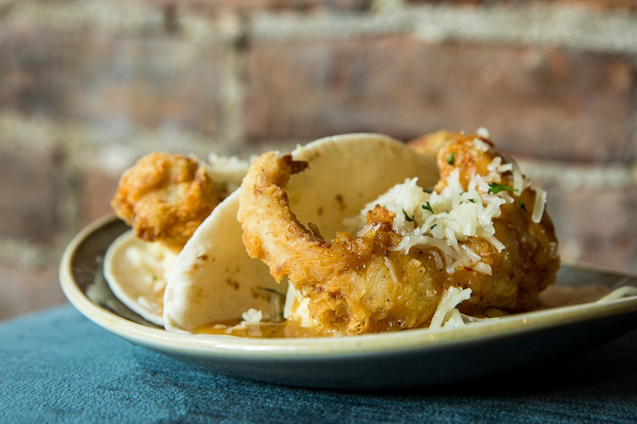 Another popular dish at LouVino is their fried chicken tacos on a flour tortilla topped with house mash, pepper gravy and Kenny&#146;s cheddar and their loaded tater tots