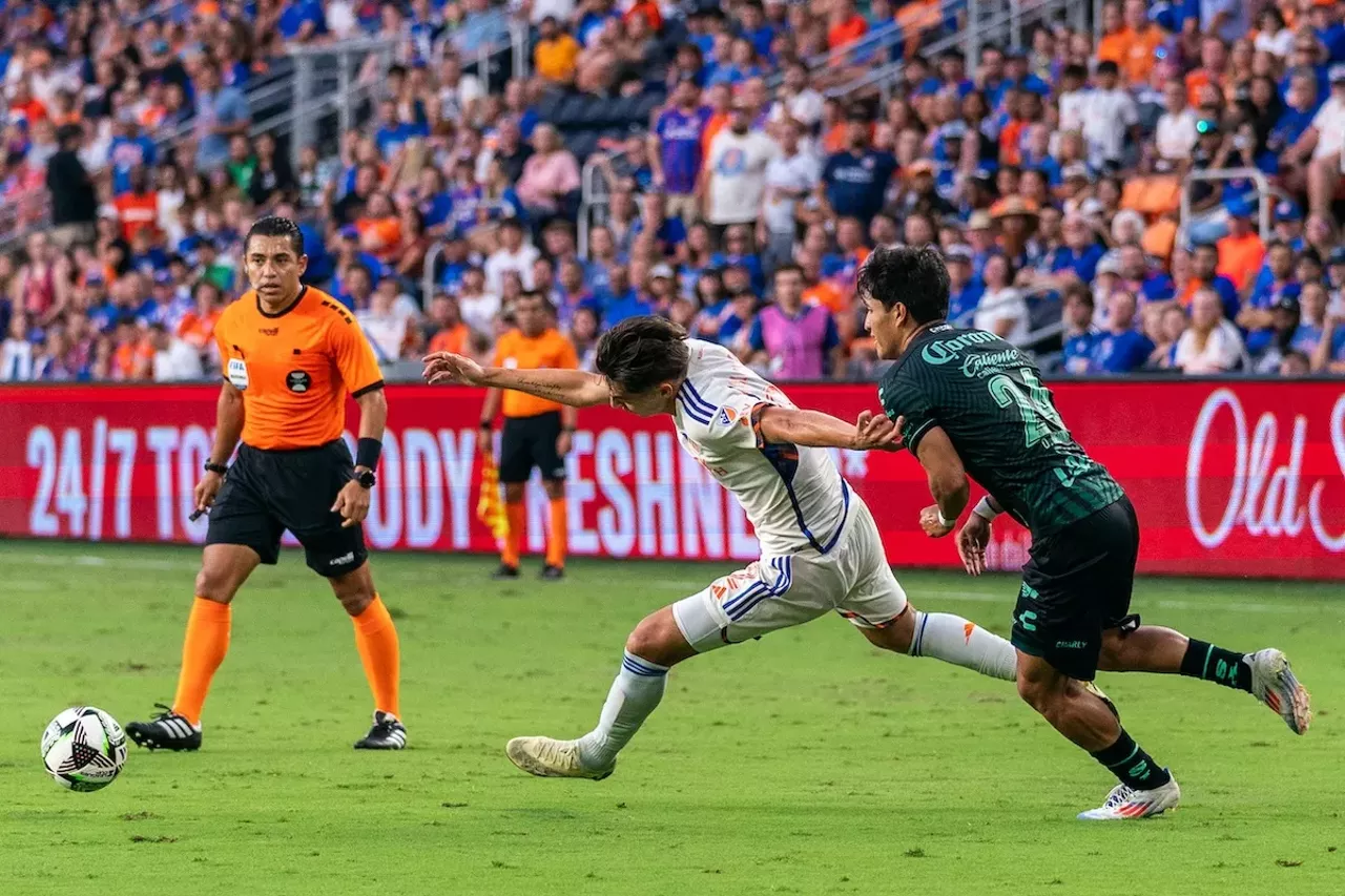 Gerardo Valenzuela at full stretch to push by defender | FC Cincinnati vs. Santos Laguna | Aug. 9, 2024