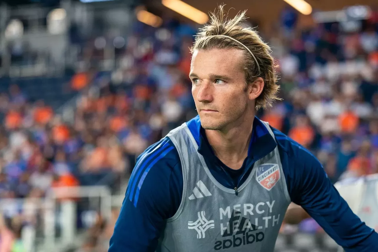 Kipp Keller watches the match from sideline while stretching | FC Cincinnati vs. Santos Laguna | Aug. 9, 2024