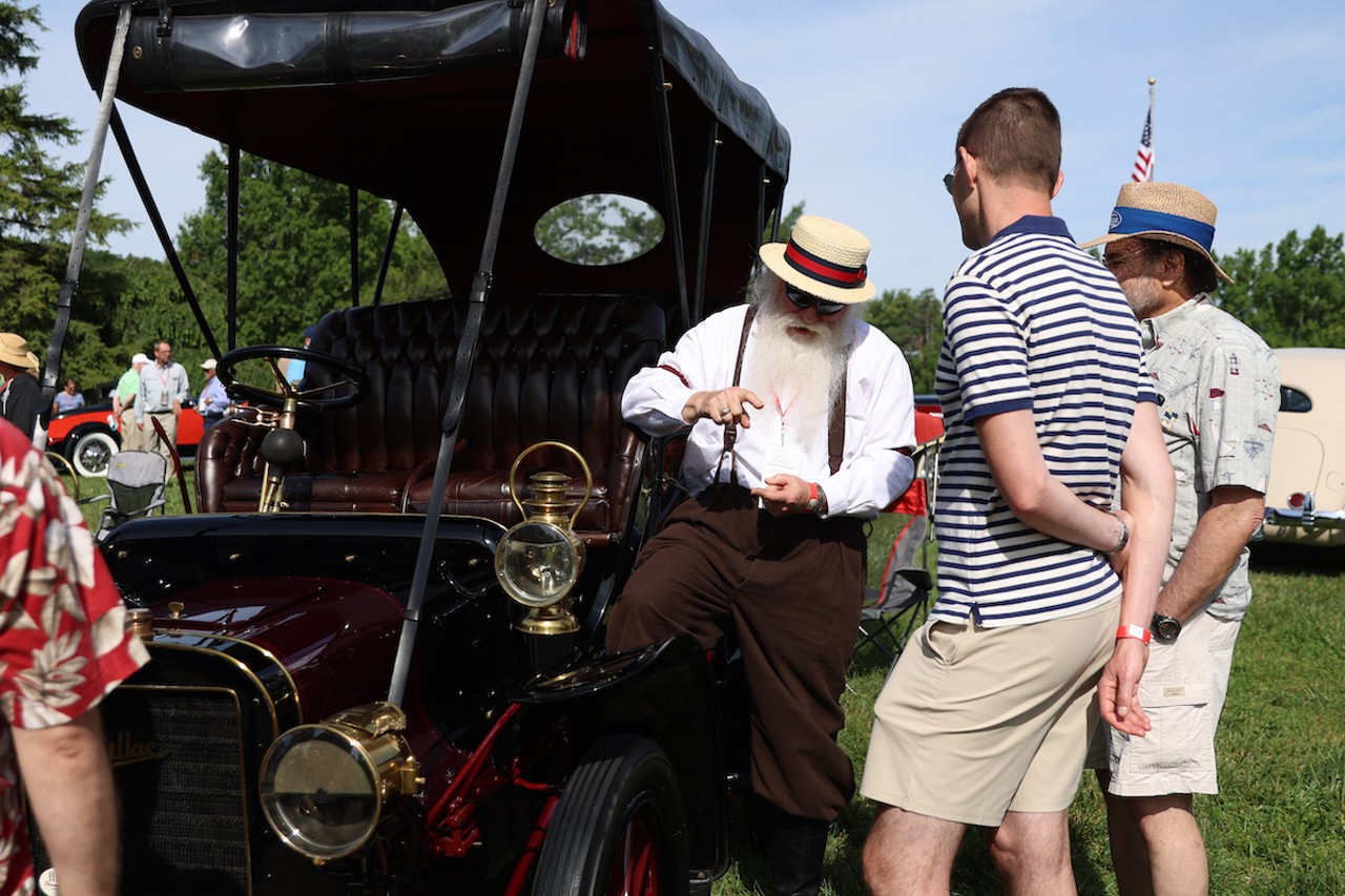 An exhibitor talks about his car to attendees at the 46th annual Cincinnati Concours d’Elegance car show on Sunday, June 9, 2024.