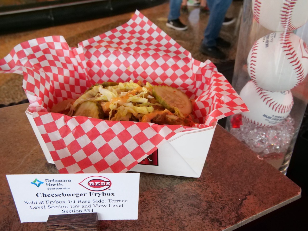 The Reds introduce new food options at Great American Ball Park on March 23, 2023, ahead of the Cincinnati Reds' 2023 season. A cheeseburger frybox is on the menu.