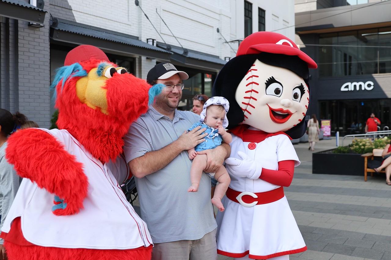 Rosie Red and Gapper take a photo with a young fan at the Olympic Opening Ceremony celebration at Newport on the Levee on Friday, July 26, 2024.