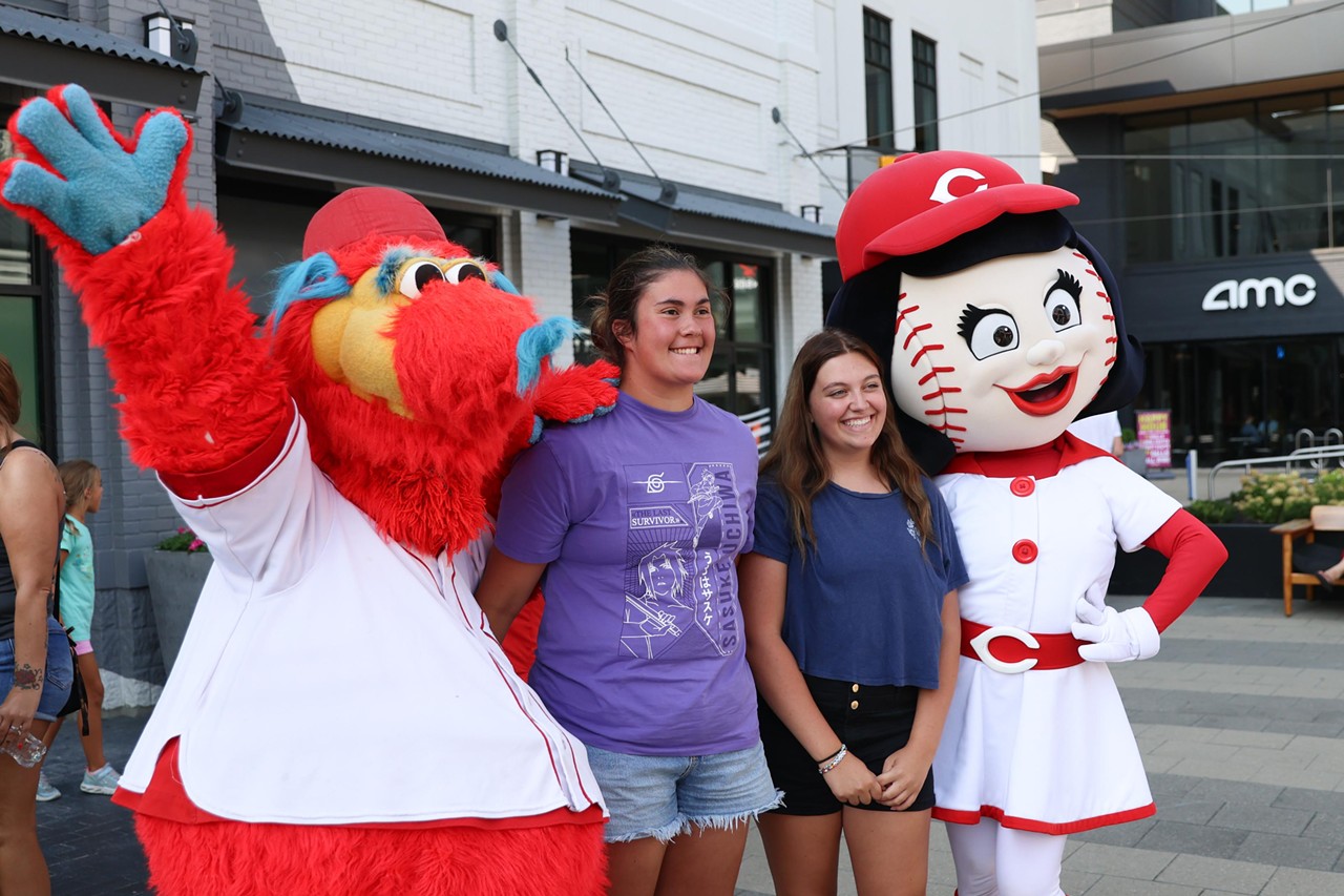 Rosie Red and Gapper take a photo with a young fan at the Olympic Opening Ceremony celebration at Newport on the Levee on Friday, July 26, 2024.