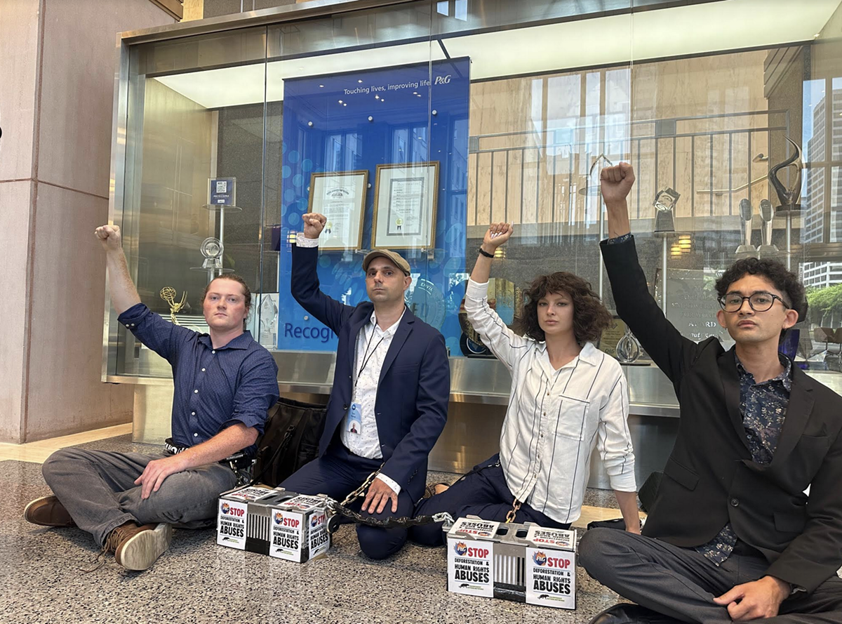 Four protesters were arrested after being asked to leave P&G headquarters in Cincinnati.