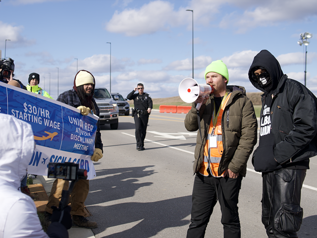 Amazon Air Hub union organizer Griffin Ritze addresses a crowd of Air Hub workers and supporters during a March 18 rally.