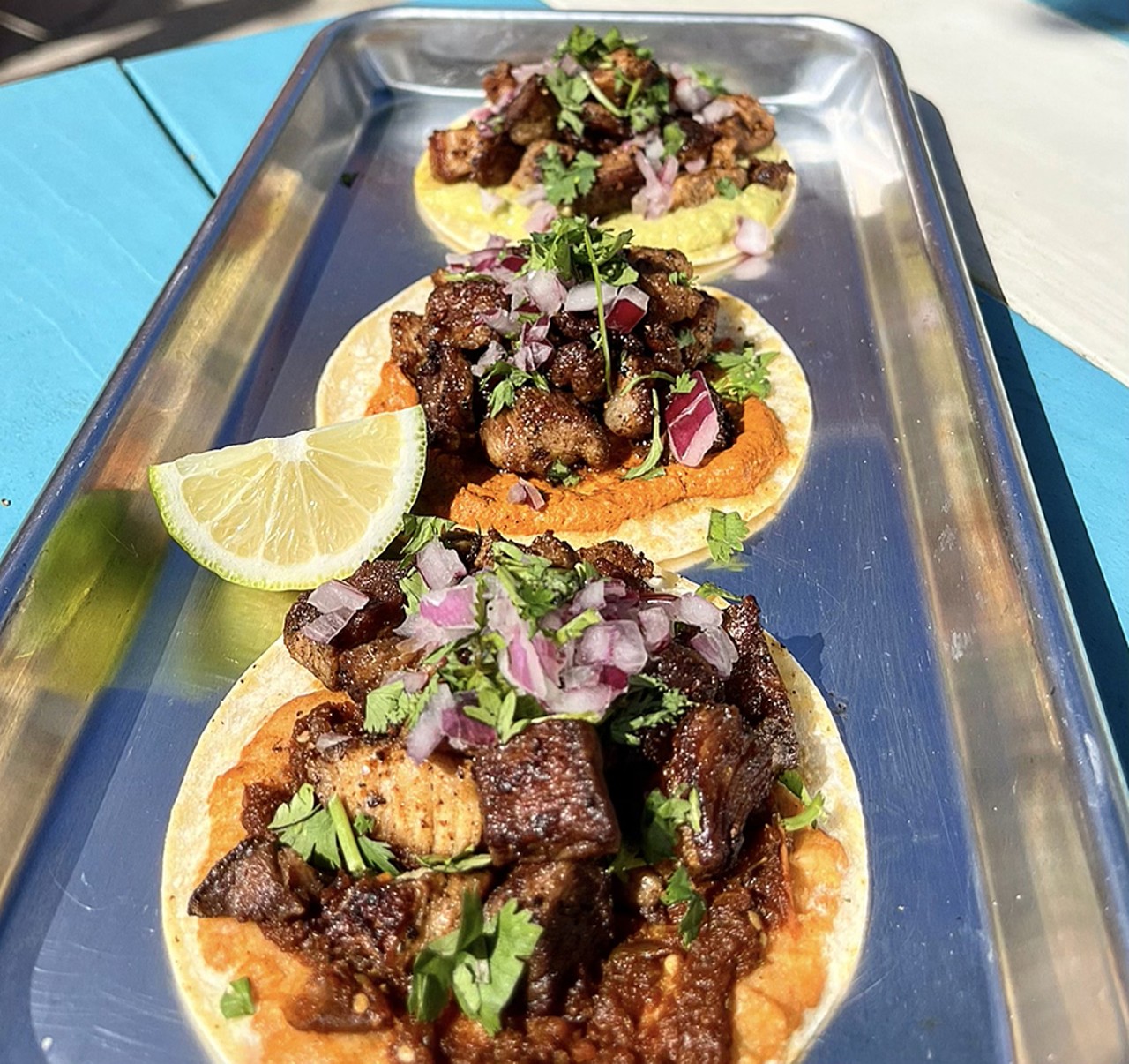 Bandito Food Park + Cantina
3543 Columbia Parkway, Columbia Tusculum
Caballeros-Street Tacos: Roasted pork (Carne asada) or roasted chicken (Pollo Asado), onions, cilantro, and your choice of Bandito's signature sauce (enfuego salsa, chipotle peanut sauce, or jalapenos cream sauce)