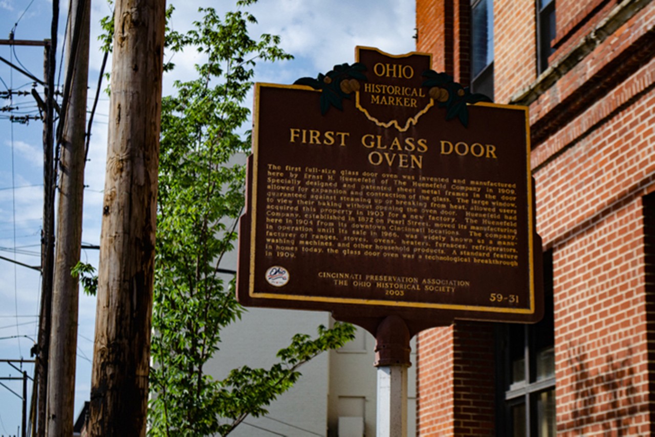 First Glass Door Oven
Where you can find the marker: In Camp Washington at the intersection of Spring Grove Avenue and Straight Street.
The history: The first full-size glass door oven was invented by Ernst H. Huenefeld in Cincinnati in 1909. The glass window allowed bakers to see their food cooking in the oven without having to open the door. The Cincinnati Preservation Association and The Ohio Historical Society erected this marker in 2003.