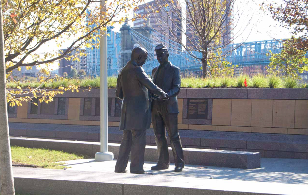 The Black Brigade of Cincinnati
Where you can find the marker: At Sawyer Point (705 E. Pete Rose Way), just east of the Purple People Bridge in downtown Cincinnati.
The history: In 1862, Cincinnati officials, worried about an invasion from Confederate troops, ordered Cincinnati citizens to form home guards. But when a group of Black men stepped in to volunteer, they were turned away and, instead, police began rounding up Black men and forcing them into service. Outraged by the treatment of these men who were willing to support the Union, the commander of the Department of Ohio sent Major General Lewis Wallace to liberate the men and command the civilians. Under the command of Judge William Martin Dickson, the Cincinnati Black Brigade, the first Black unit with a military purpose in the Civil War, was formed. In September of 1862, the Brigade, made up of about 1,000 members, worked to clear forests and build fortifications, military roads and rifle pits. The unit received praise for their work and disbanded when Southern forces no longer threatened the city. Members later fought with other Black regiments, including the 127th Ohio Volunteer Infantry.