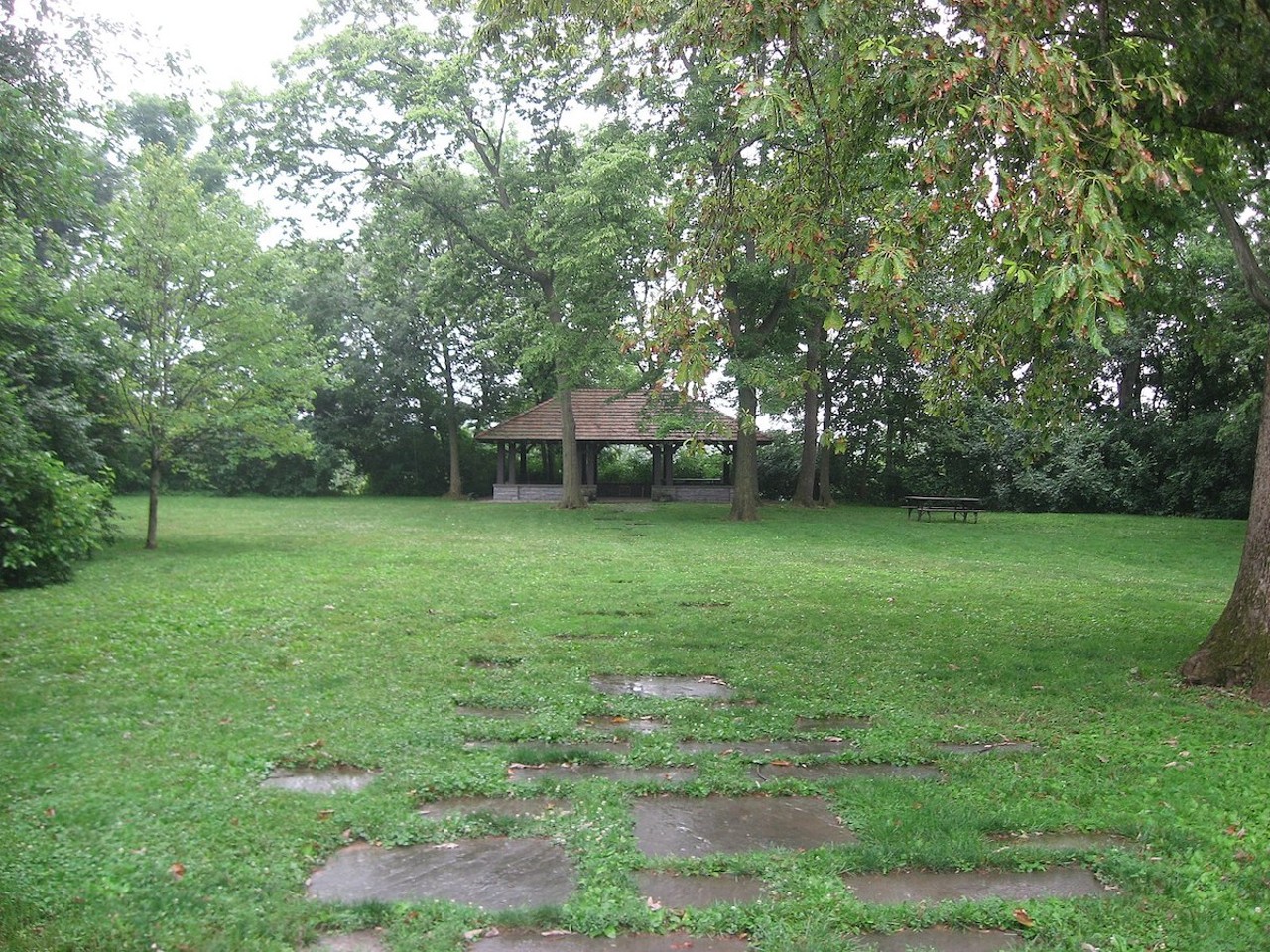 The Madisonville Site
Where you can find the marker: In a small park at the very end of Mariemont Avenue in Mariemont.
The history: A place once so abundant in artifacts it was nicknamed “pottery field,” the Madisonville site is the largest and most studied villages of the Fort Ancient people, who inhabited the area from around 1450 to 1670. Archaeologists from Harvard trained at the site from 1879 to 1911, and doctor and archaeologist Charles Metz, with help from Harvard anthropologist Frederic Ward Putnam, excavated the remains of the village, uncovering houses, storage pits and burials. Town planner John Nolen designed a pavilion to honor the site, but it wasn’t built until 2001.