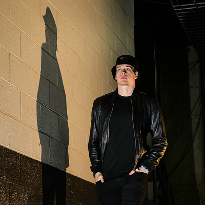 Cincinnati Bengals quarterback Joe Burrow wears a black leather jacket and bucket hat before the game against the Cleveland Browns on Dec. 11, 2022.