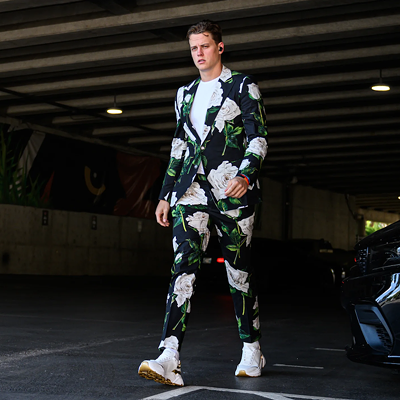 Cincinnati Bengals quarterback Joe Burrow wears a floral suit before the game against the Miami Dolphins on Sept. 29, 2022.