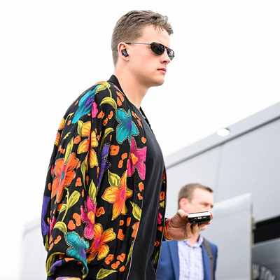 Cincinnati Bengals quarterback Joe Burrow wears a multicolored jacket before the game against the Tennessee Titans on Nov. 27, 2022.