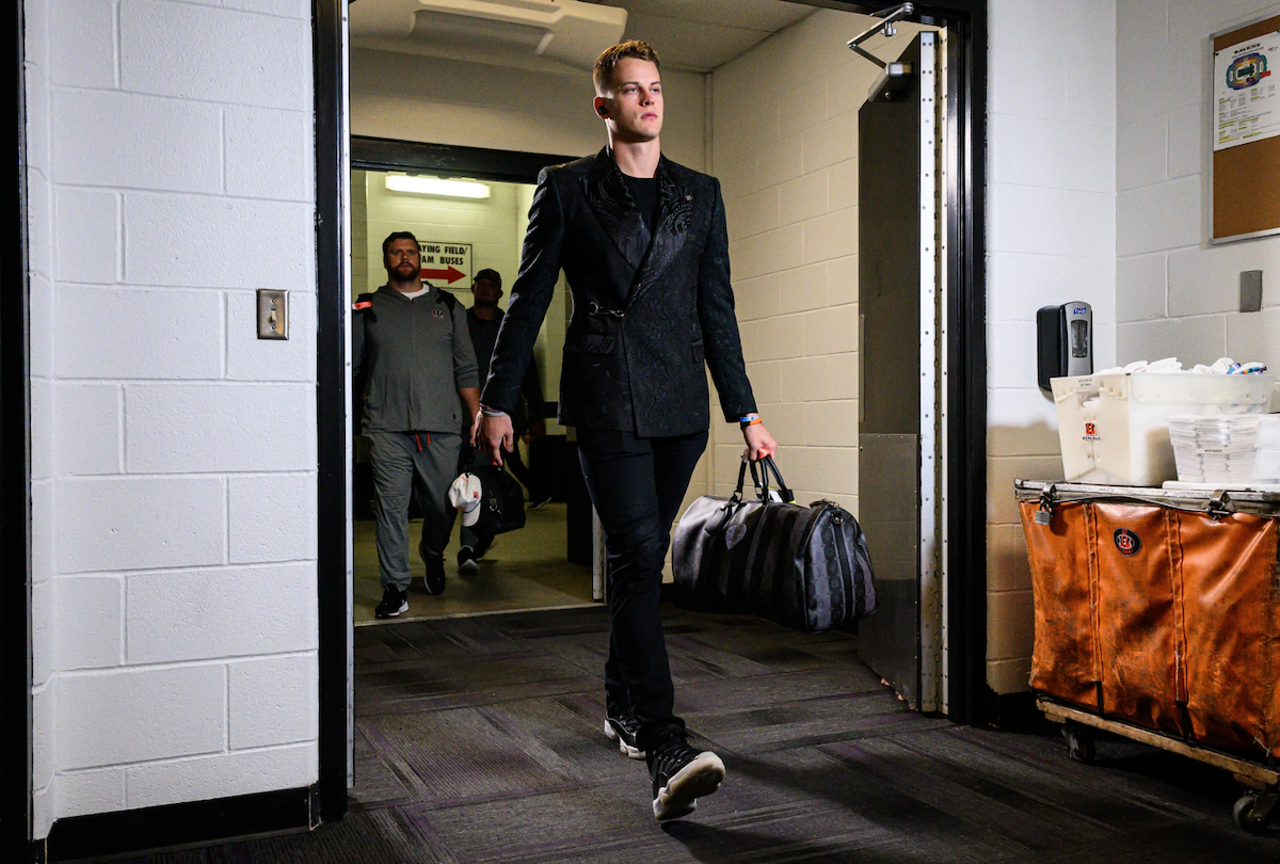 Cincinnati Bengals quarterback Joe Burrow wears a black embroidered suit before the game against the Baltimore Ravens on Dec. 9, 2022.