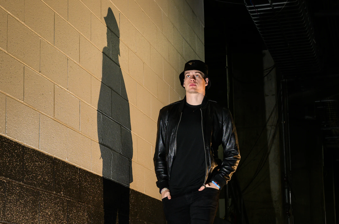 Cincinnati Bengals quarterback Joe Burrow wears a black leather jacket and bucket hat before the game against the Cleveland Browns on Dec. 11, 2022.