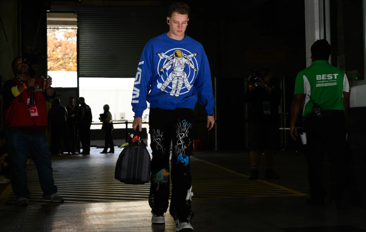 Cincinnati Bengals quarterback Joe Burrow wears a blue NASA sweatshirt and embellished pants before the game against the Atlanta Falcons on Oct. 23, 2022.