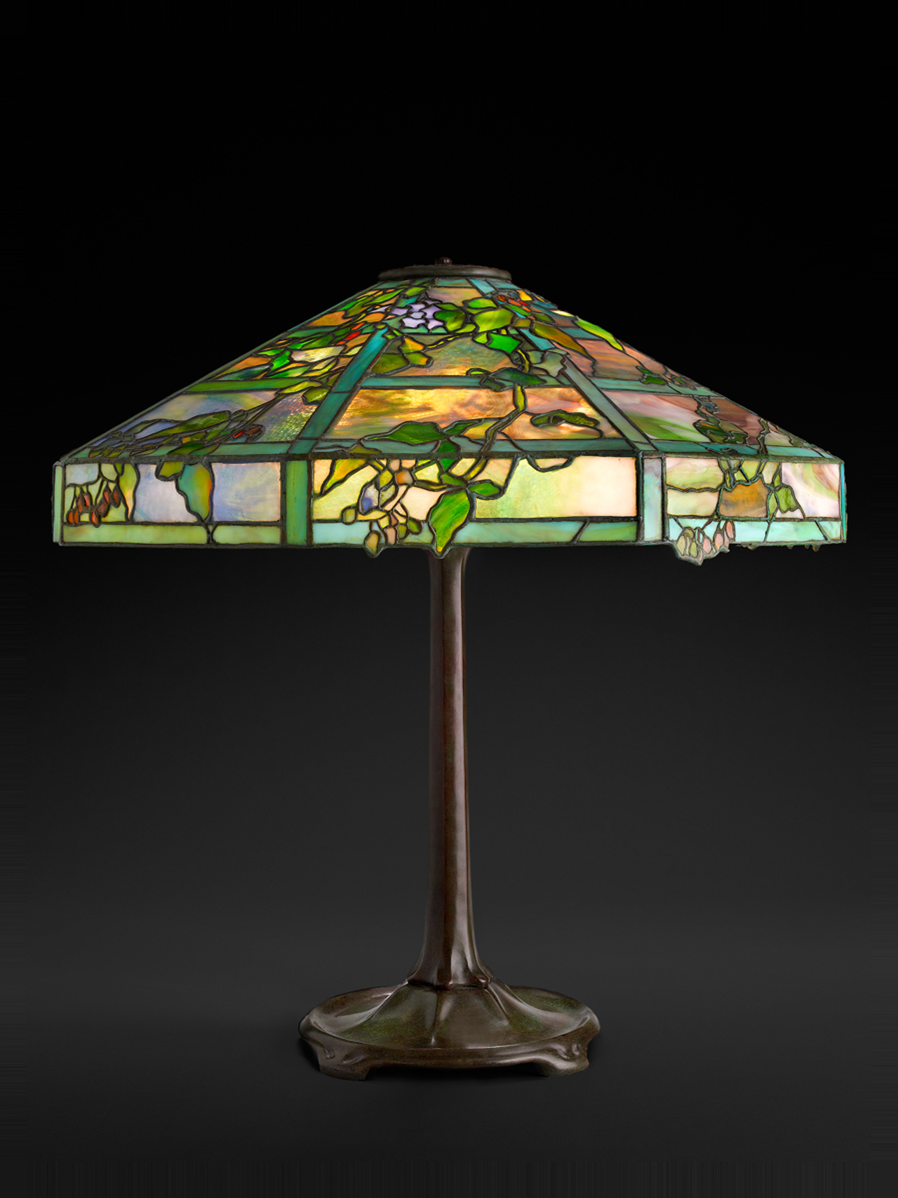 Tiffany Studios, October Night Table Lamp, about 1910, leaded glass, patinated bronze.